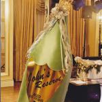 A 7' tall Champagne bottle that explodes confetti, with event branding